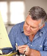 Senior man model making