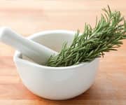 Bunch of rosemary in a pestle