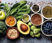 A selection of fruits and vegetables containing vitamins and healthy fats