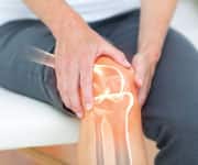 painful, damaged knee joint due to aging