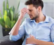 man experiencing fatigue from jet lag