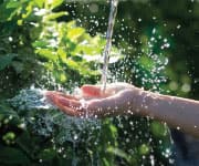 water pouring over a hand