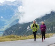 Couple jogging through mountains