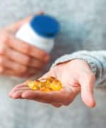 Handful of Vitamin softgels