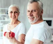 Man and woman holding a barbell