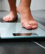 Person stepping on a scale