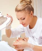 Dermatologist looking at skin