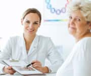 Woman smiling with doctor