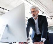 Man reading a computer screen