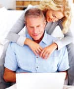 Man and woman using computer