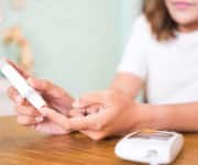 Woman Checking Blood Sugar