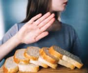 Woman turning down bread