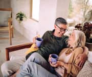 Man and woman sitting on couch