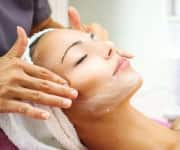 Woman having face cleaned