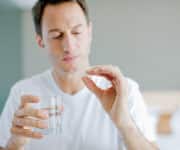 Man taking medicine