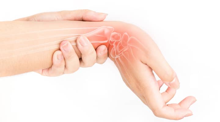 Woman holding hand feeling rebuilding joint in wrist