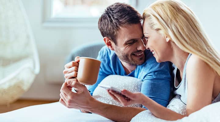 Couple in bed using botanical-based extracts for female sexual dysfunction