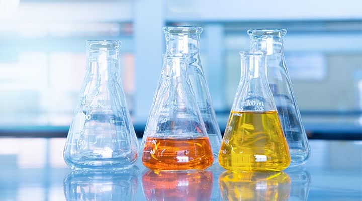 Five beakers filled with different types of selenium for testing modulating gene expression