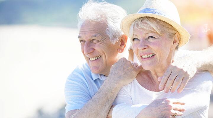 Senior couple that are smiling that are hoping to live to be centenarians