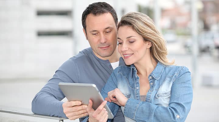 Couple reading the Disease and Treatment 5th edition together for medical literacy
