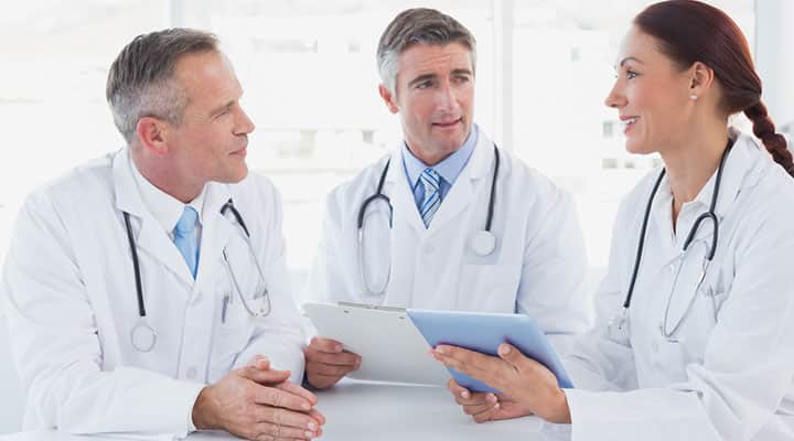 Group of researchers examining previous zinc lozenges studies