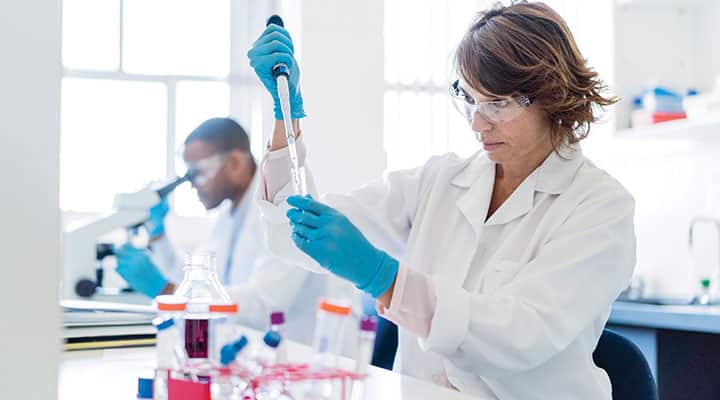 Two scientist in lab funded through the Life Extension Foundation for biomedical research