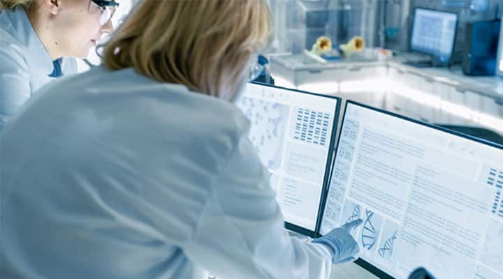 Scientists looking at results of interleukin-2 immune boosting