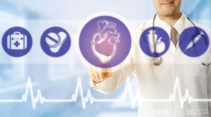 Doctor selecting heart option on screen for CoQ10