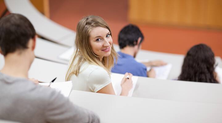 Student with ADHD is turned around and not paying attention in class