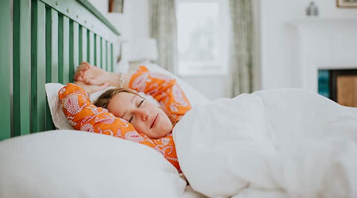 Woman asleep in bed