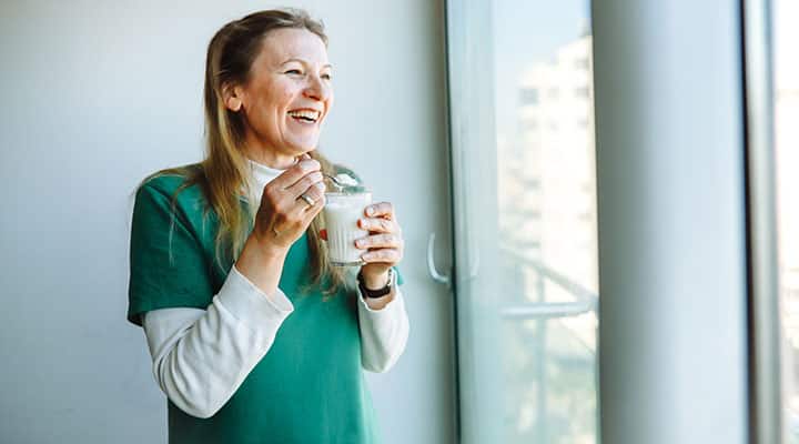 Woman eating probiotics
