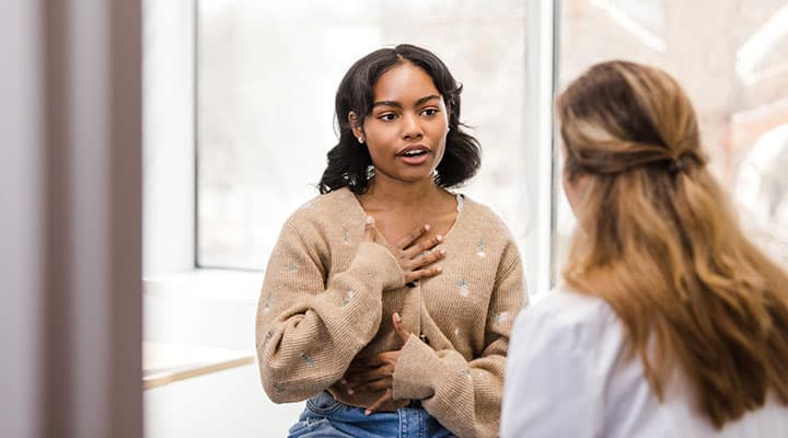 Young woman speaking to psychologist about antidepressants