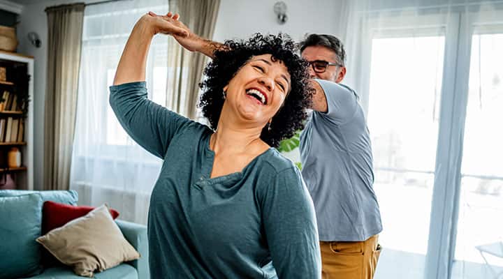 Couple dancing at home