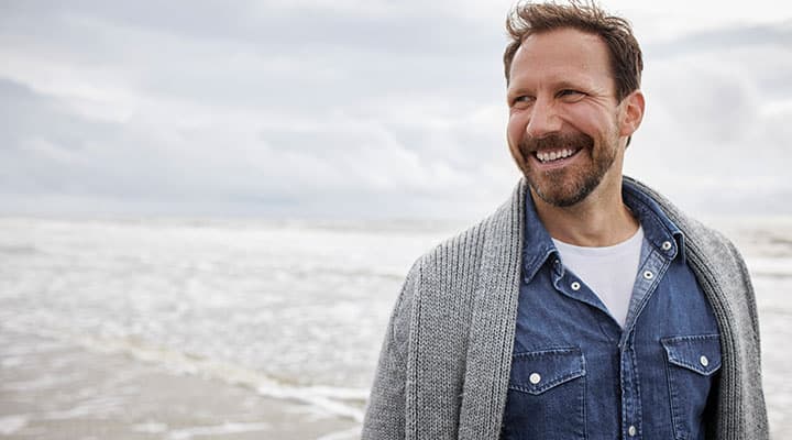 Man smiling on the beach