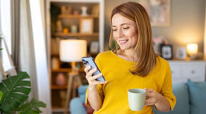 Woman reading about probiotic strains for mood support