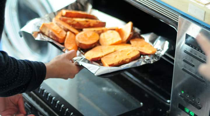 Older man playing tennis outside to keep his muscles and bones healthy