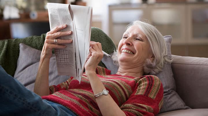 Woman doing a crossword puzzle