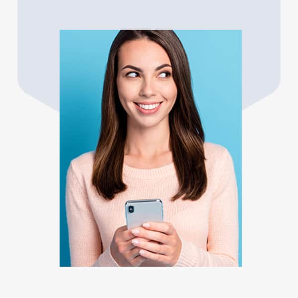 A woman checking her text message for the latest Life Extension deals