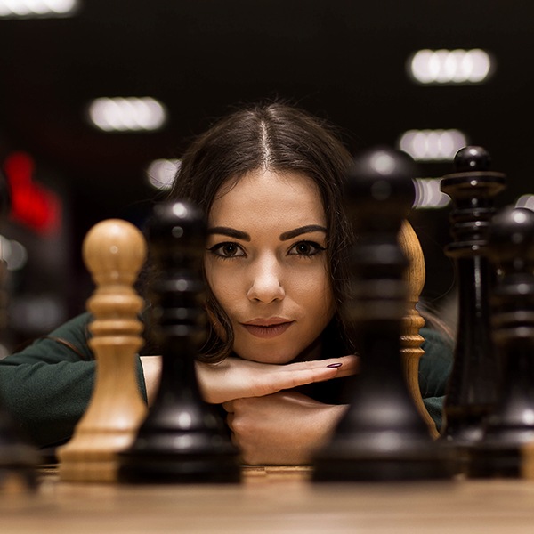 Woman Mentally Focus Playing Chess. Brain Health Specialty Shop