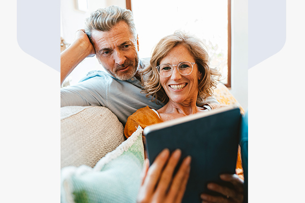 Man and woman looking at a tablet