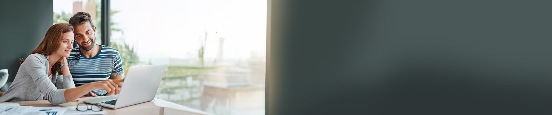 couple look at a computer