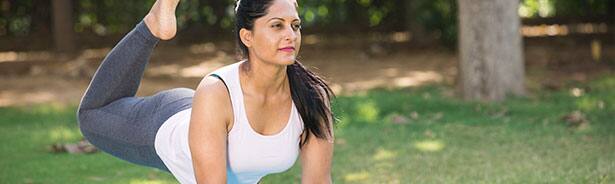 Woman doing yoga in park