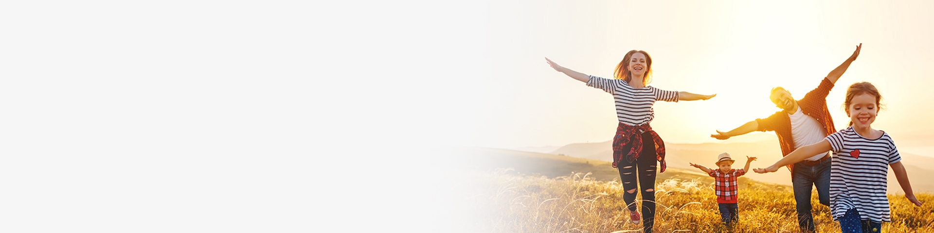 happy family running in a field