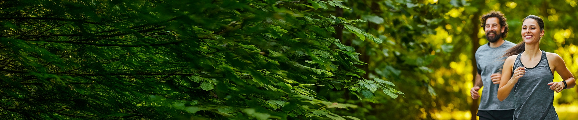 Young couple jogging outdoors, enjoying their active lifestyle and the beautiful natural surroundings