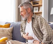 The reduction of H. pylori levels can be measured using a urea breath test.