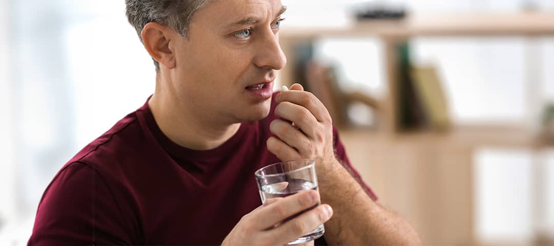 Person taking vitamin