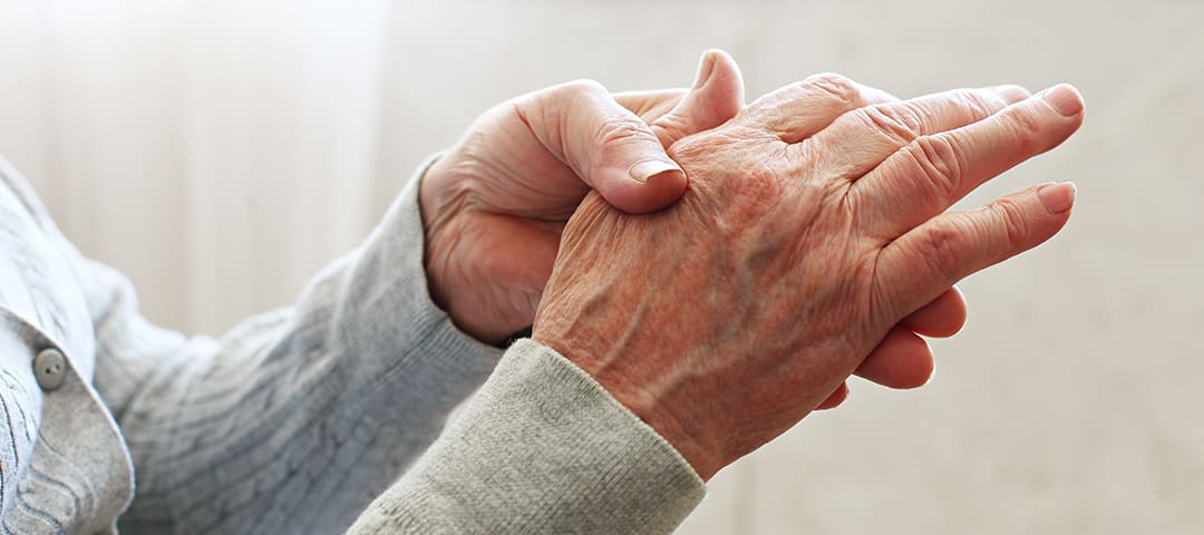 Person holding their other hand