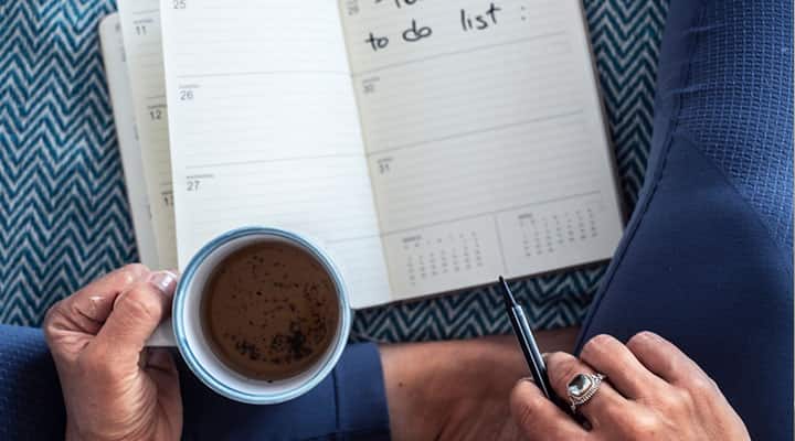 Woman starting her day early and prioritizing tasks