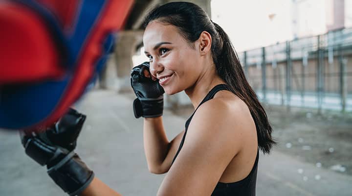 Woman boxer training to fighting off immune challenges
