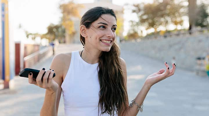 Woman nervously laughing to dissipate unwanted feelings